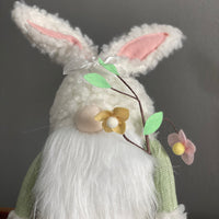 Sitting Gnome with Spring Flower