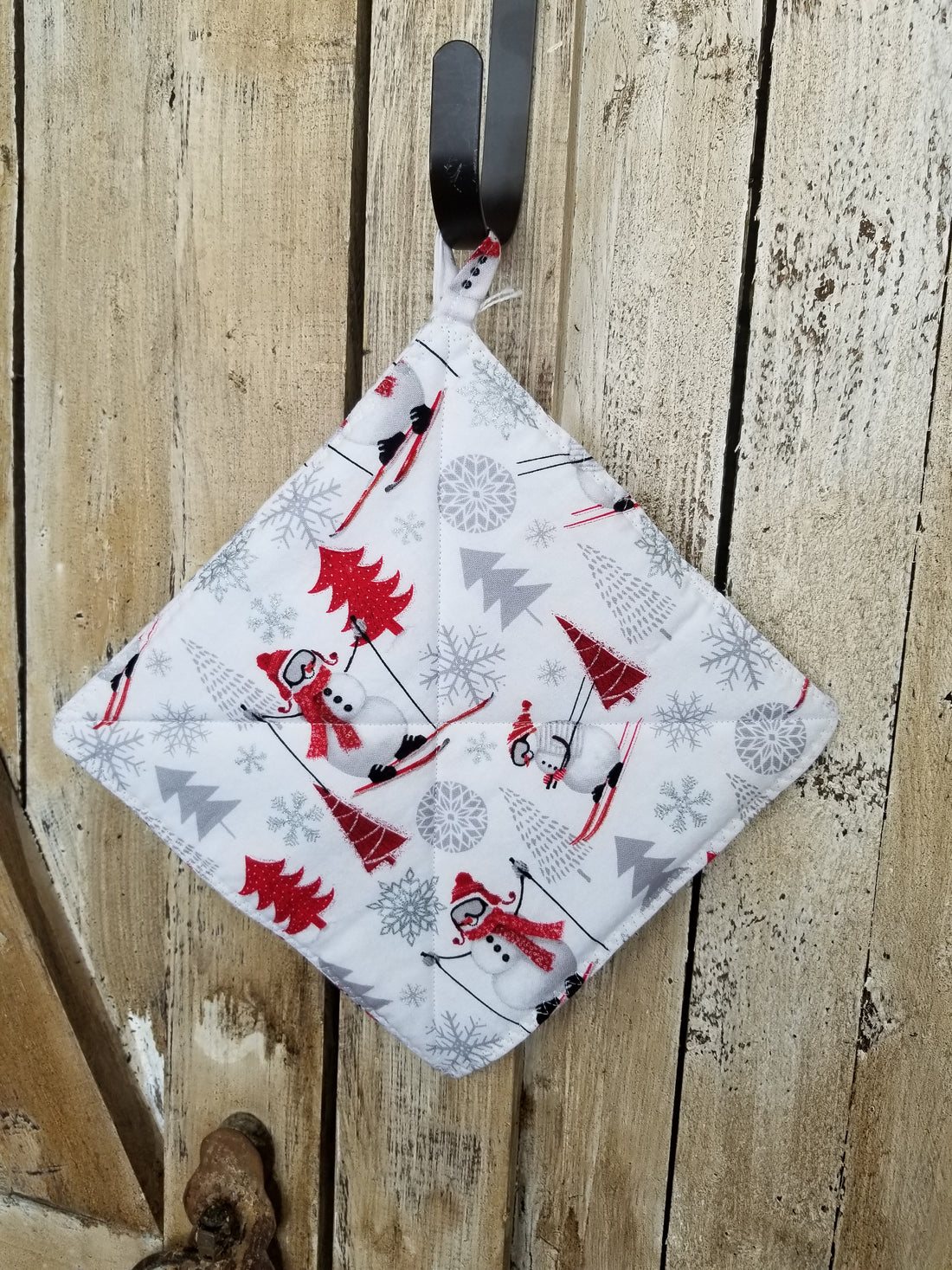 Skiing Snowmen Hot Pad