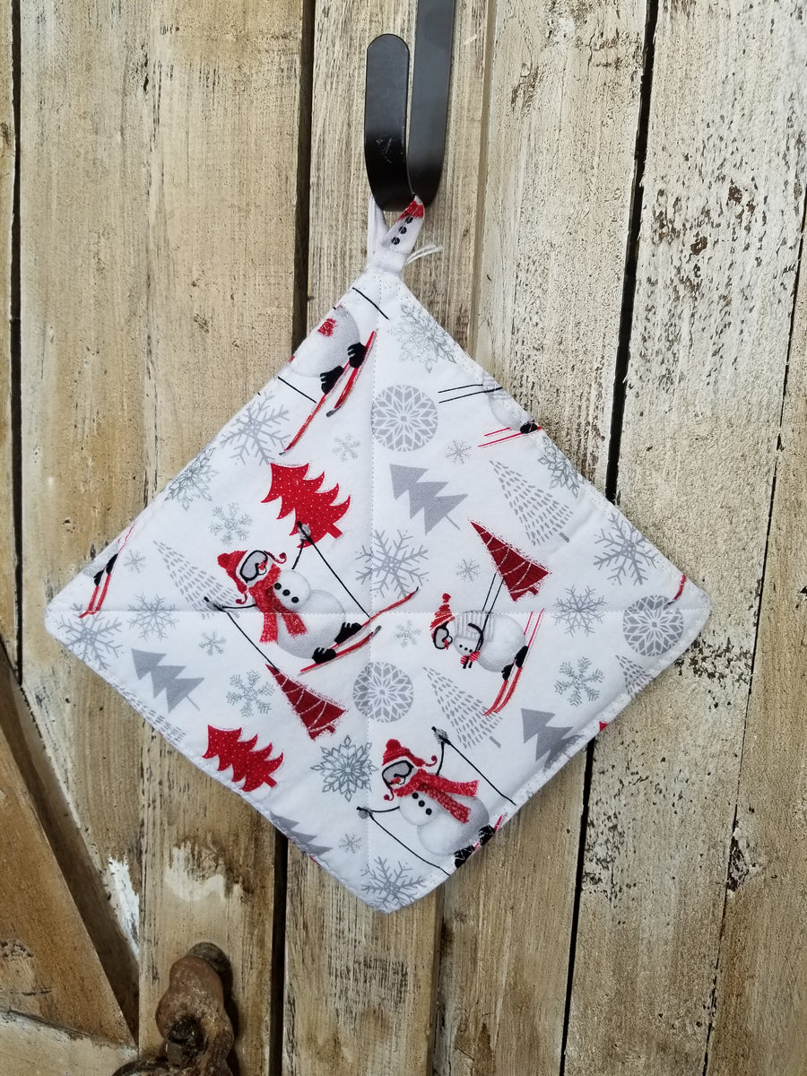Skiing Snowmen Hot Pad