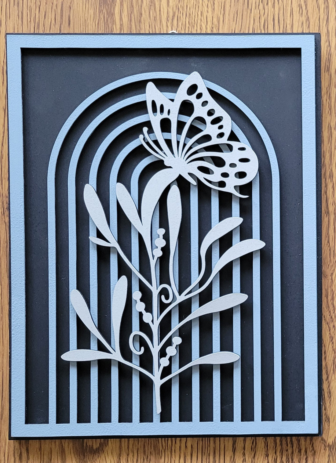 Arch With Plant + Butterfly Laser Sign