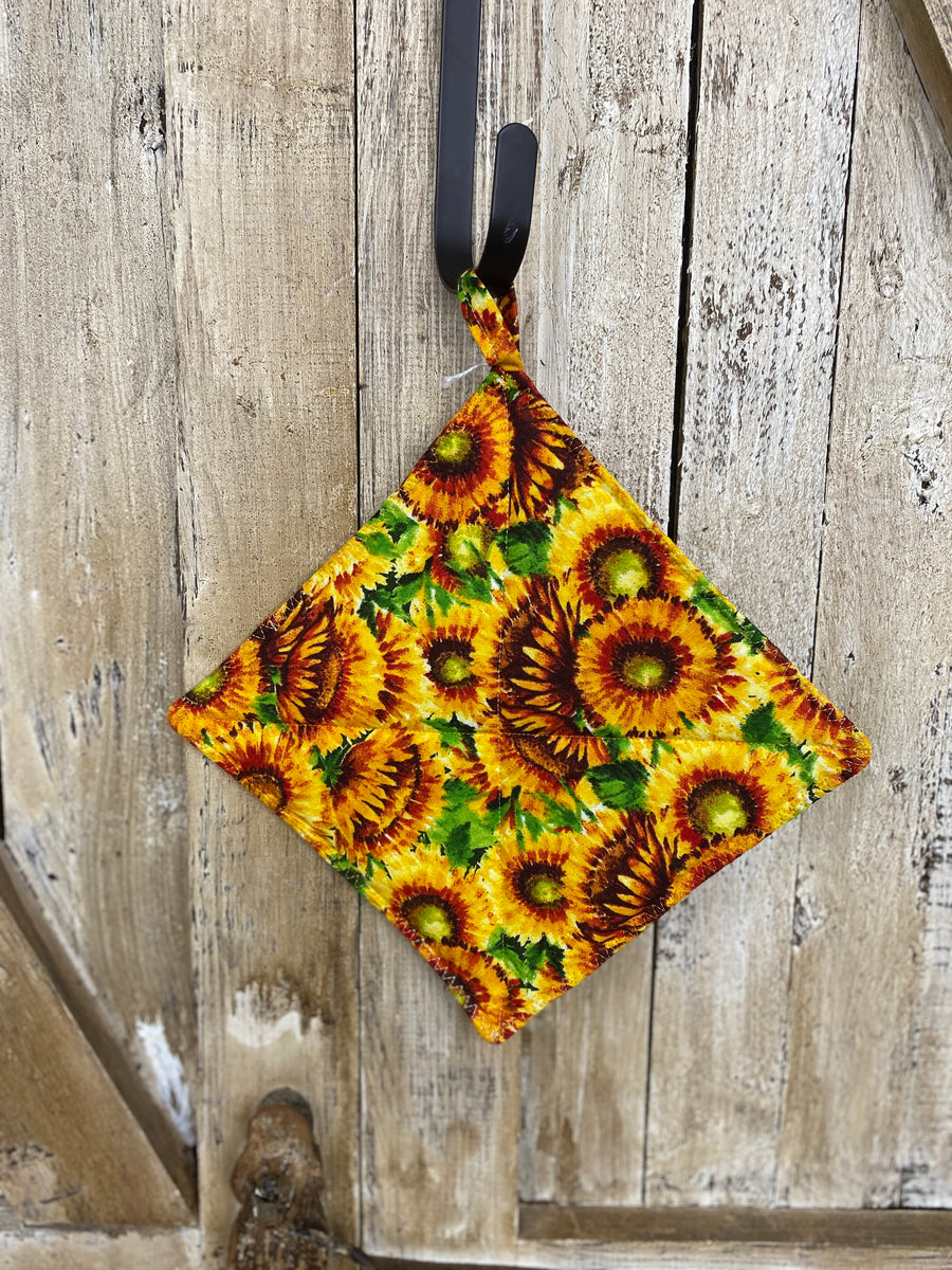 Sunflowers with Green Leaves Hot Pad