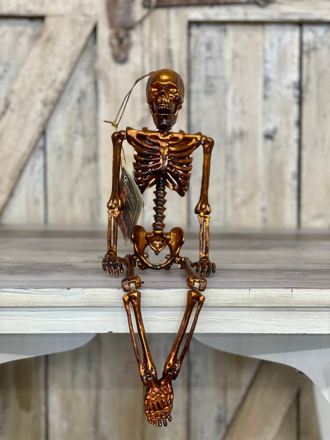 Bronze Orange Hanging Skeleton